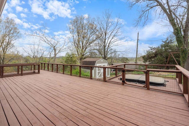 101 Poindexter Dr, Pineville, MO 64856 - deck featuring a storage shed and an outbuilding