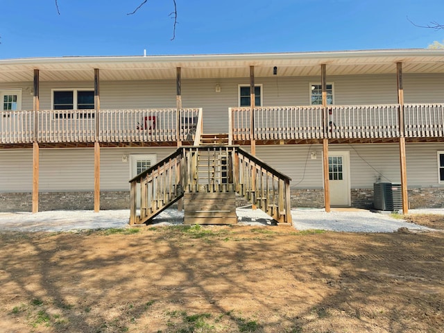 back of property with central AC