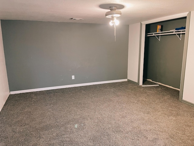 unfurnished bedroom featuring baseboards, a closet, and carpet