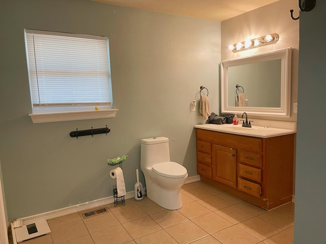 bathroom with tile patterned floors, toilet, visible vents, baseboards, and vanity