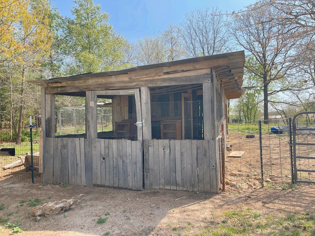 view of poultry coop featuring fence