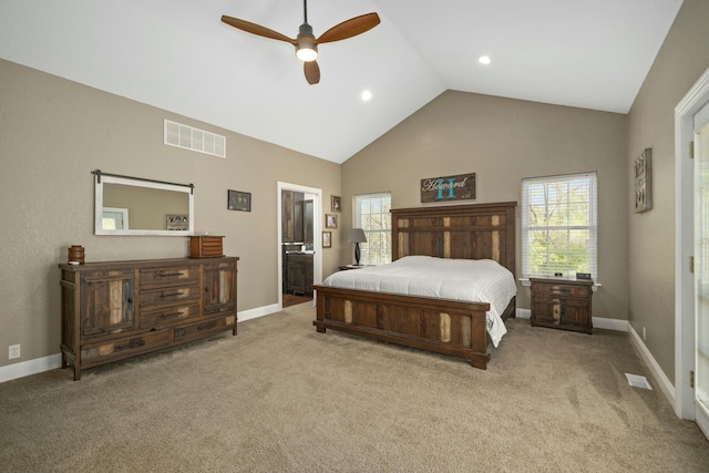 carpeted bedroom featuring ensuite bathroom, visible vents, high vaulted ceiling, and multiple windows