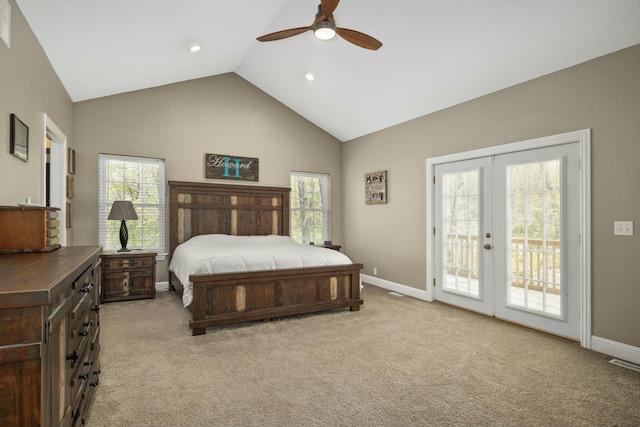 bedroom featuring baseboards, multiple windows, and access to exterior