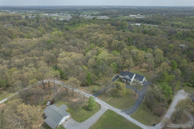 aerial view featuring a wooded view