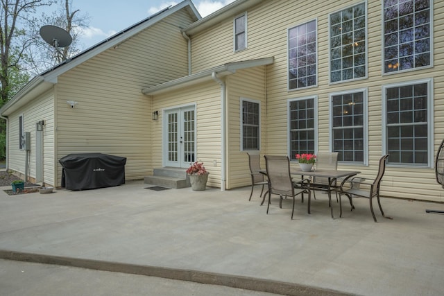 view of patio with outdoor dining area and french doors