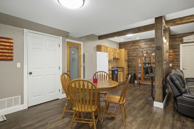 dining area featuring dark wood-type flooring, visible vents, log walls, beam ceiling, and wine cooler
