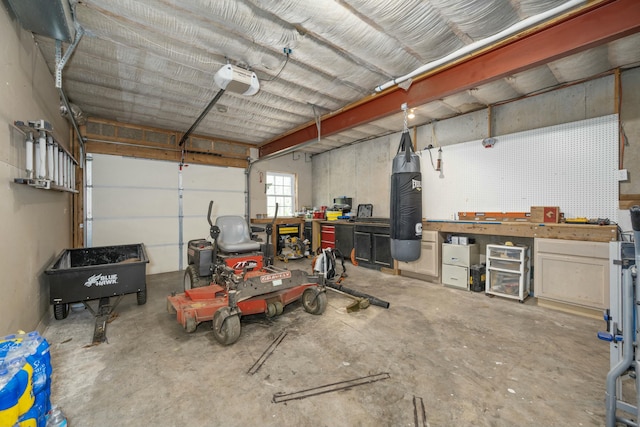 garage featuring a workshop area and a garage door opener