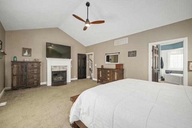 bedroom featuring a fireplace with flush hearth, lofted ceiling, visible vents, carpet floors, and baseboards