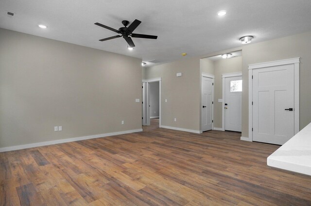 5464 Anita Ave, Pleasant Hope, MO 65725 - unfurnished living room featuring wood finished floors, a ceiling fan, baseboards, and recessed lighting