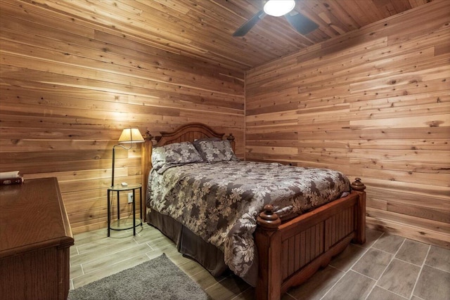7745 Murr Rd, Graff, MO 65660 - bedroom with wood ceiling, a ceiling fan, and wood walls