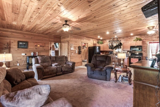 7745 Murr Rd, Graff, MO 65660 - living room featuring wood ceiling, ceiling fan, wooden walls, and carpet
