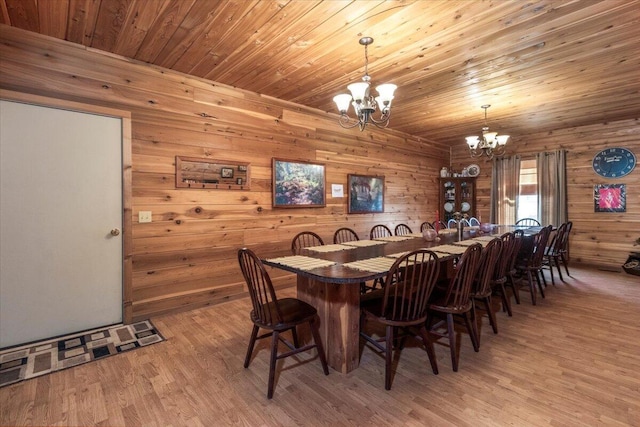 7745 Murr Rd, Graff, MO 65660 - dining area featuring wood ceiling, an inviting chandelier, wood walls, and light wood finished floors