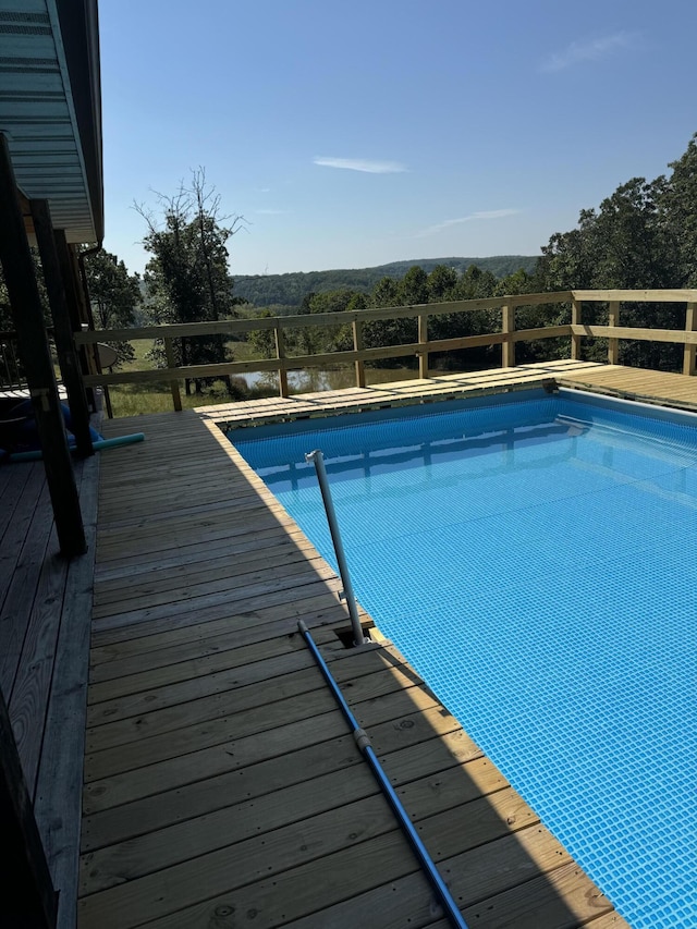 7745 Murr Rd, Graff, MO 65660 - pool with a wooden deck