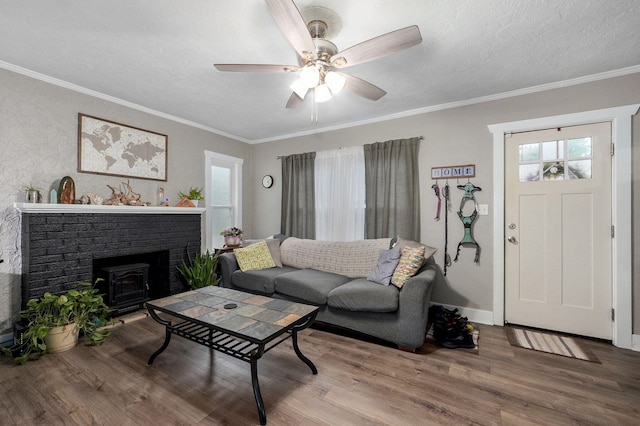 953 S Weaver Ave, Springfield, MO 65806 - living area with wood finished floors, ceiling fan, crown molding, a textured ceiling, and baseboards