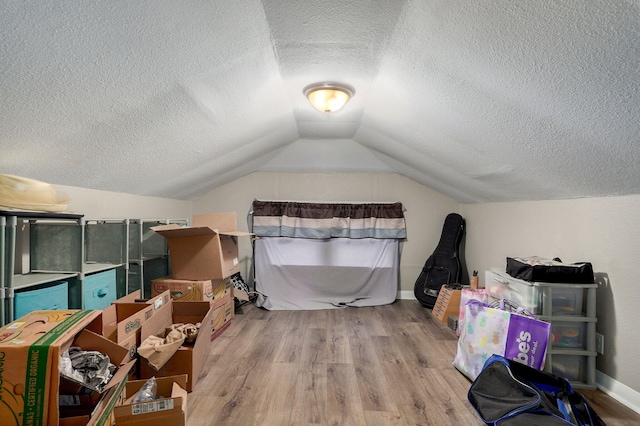 953 S Weaver Ave, Springfield, MO 65806 - bonus room with a textured ceiling, wood finished floors, vaulted ceiling, and baseboards