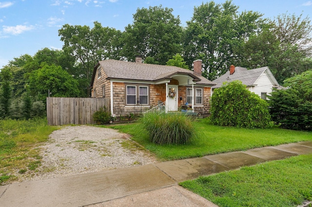 953 S Weaver Ave, Springfield, MO 65806 - view of front of property with roof with shingles, gravel driveway, and a chimney