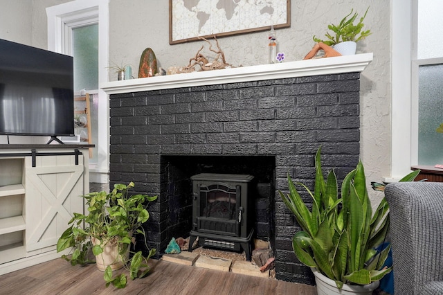 953 S Weaver Ave, Springfield, MO 65806 - detailed view of wood finished floors and a wood stove