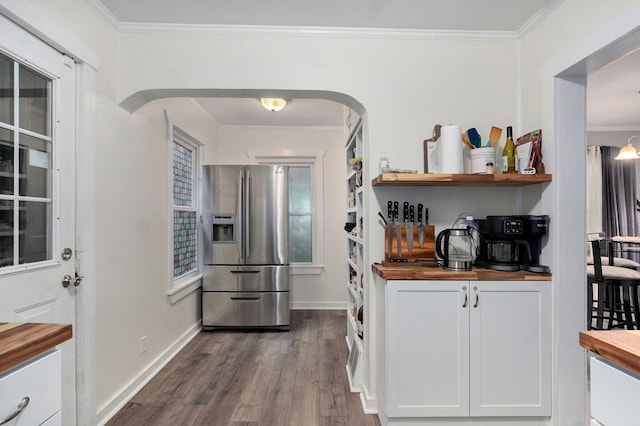 953 S Weaver Ave, Springfield, MO 65806 - kitchen with wood counters, stainless steel refrigerator with ice dispenser, crown molding, dark wood-style floors, and arched walkways