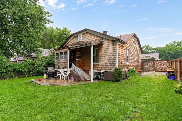 953 S Weaver Ave, Springfield, MO 65806 - back of house with a gate and a chimney
