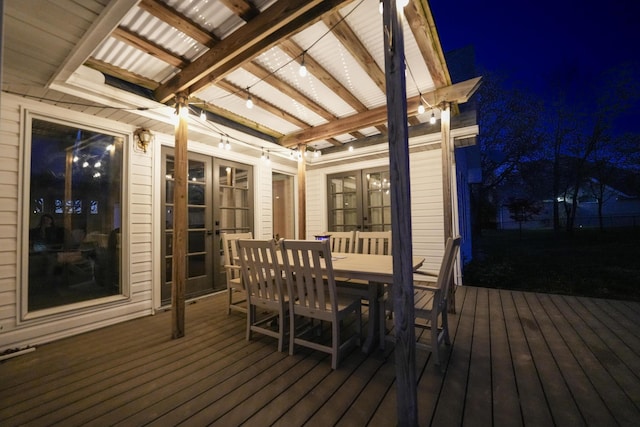 344 Zinnia Ln, Kirbyville, MO 65679 - deck at twilight featuring french doors and outdoor dining area