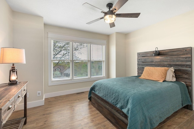 344 Zinnia Ln, Kirbyville, MO 65679 - bedroom with wood finished floors, baseboards, and ceiling fan