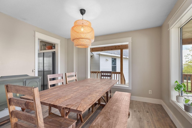 344 Zinnia Ln, Kirbyville, MO 65679 - dining area featuring wood finished floors and baseboards