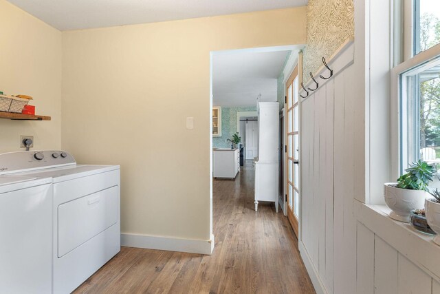 344 Zinnia Ln, Kirbyville, MO 65679 - laundry area featuring washing machine and clothes dryer, light wood-style flooring, and baseboards