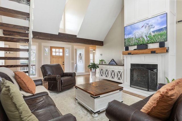 344 Zinnia Ln, Kirbyville, MO 65679 - living room with a fireplace with raised hearth, high vaulted ceiling, and light wood-style floors
