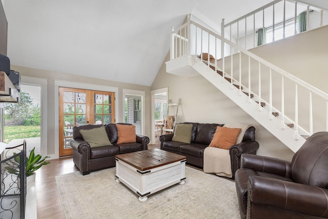 344 Zinnia Ln, Kirbyville, MO 65679 - living area with high vaulted ceiling, light wood finished floors, stairway, and french doors