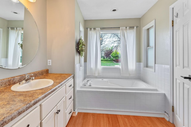 344 Zinnia Ln, Kirbyville, MO 65679 - full bathroom with wood finished floors, a bath, and vanity