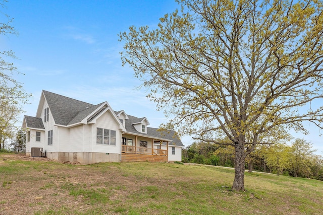 344 Zinnia Ln, Kirbyville, MO 65679 - view of home's exterior featuring central AC unit, a yard, a porch, and a shingled roof