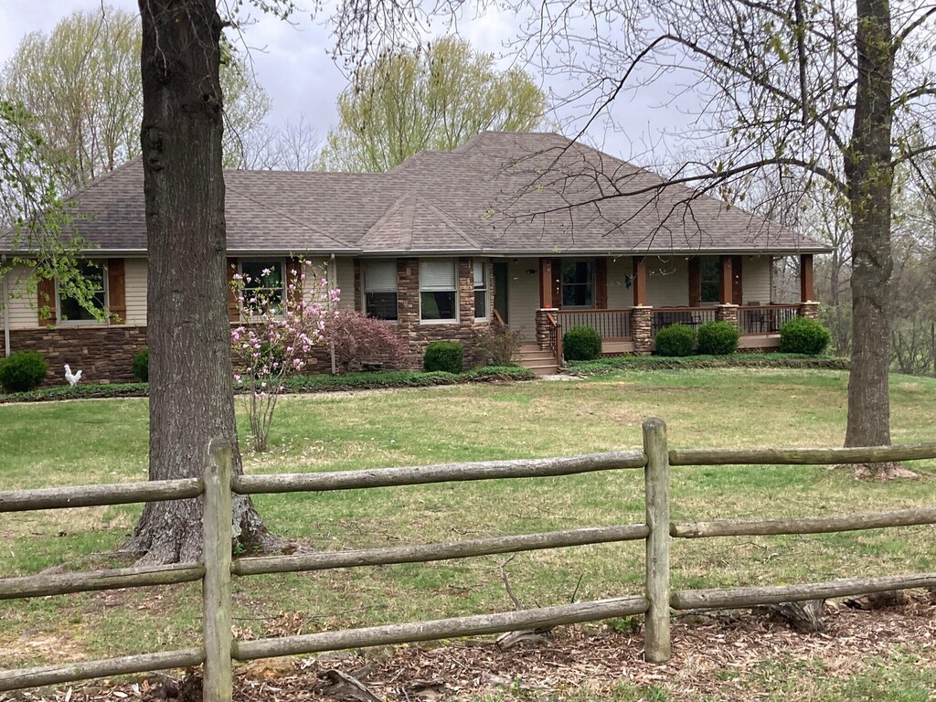 6475 S Farm Rd Unit 193, Rogersville, MO 65742 - view of front of house featuring covered porch and roof with shingles