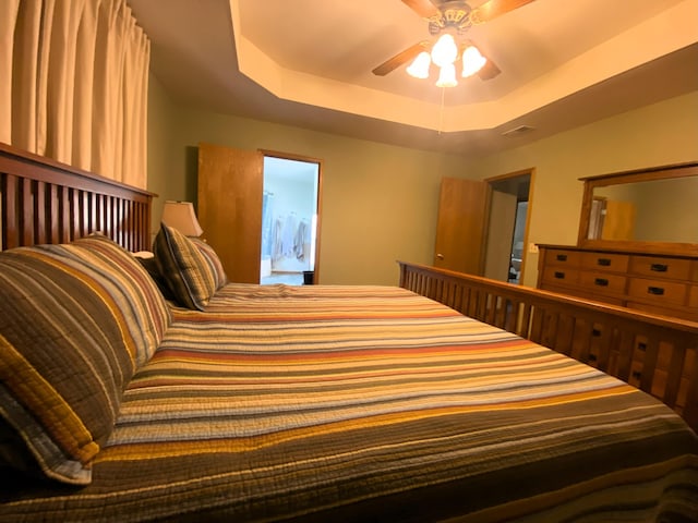 6475 S Farm Rd Unit 193, Rogersville, MO 65742 - bedroom with a raised ceiling and ceiling fan