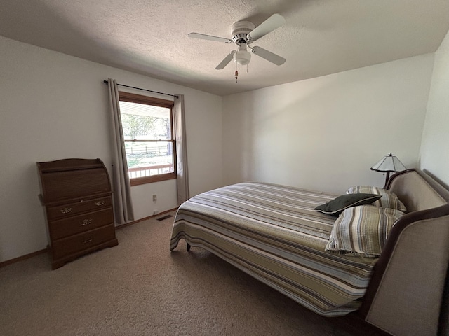 6475 S Farm Rd Unit 193, Rogersville, MO 65742 - carpeted bedroom featuring a ceiling fan, baseboards, and a textured ceiling