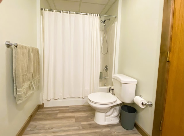 6475 S Farm Rd Unit 193, Rogersville, MO 65742 - bathroom with baseboards, toilet, wood finished floors, shower / bath combo, and a paneled ceiling