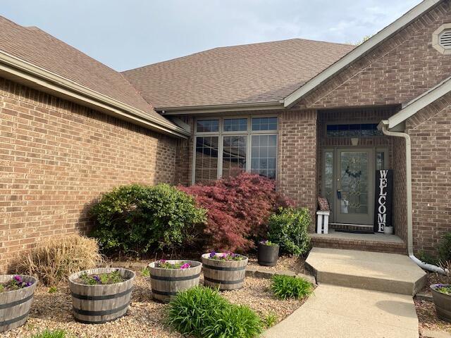 4822 S Montrose Pl, Springfield, MO 65810 - view of exterior entry featuring brick siding
