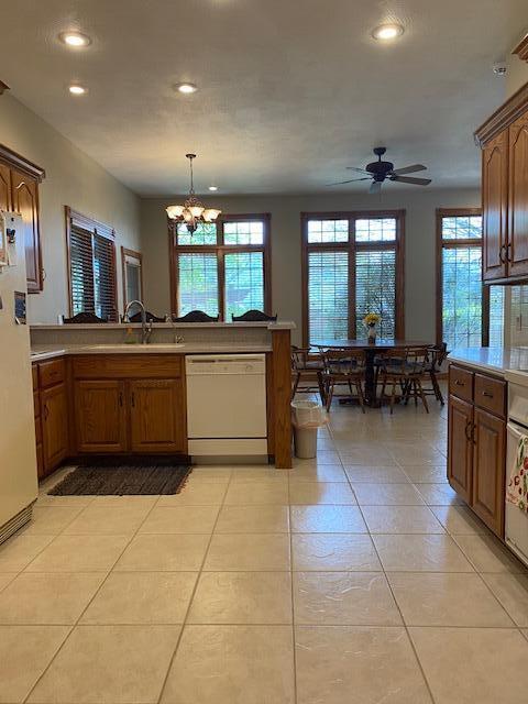 4822 S Montrose Pl, Springfield, MO 65810 - kitchen featuring a healthy amount of sunlight, a sink, white appliances, and recessed lighting