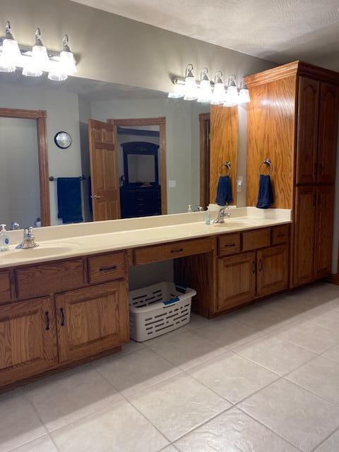4822 S Montrose Pl, Springfield, MO 65810 - bathroom with vanity and tile patterned flooring