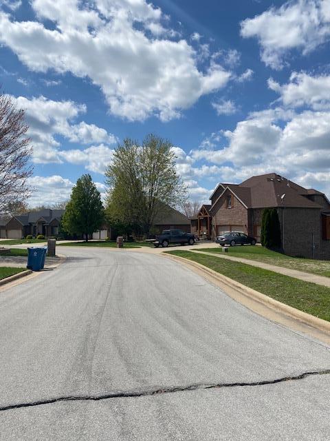 4822 S Montrose Pl, Springfield, MO 65810 - view of street with a residential view, curbs, and sidewalks