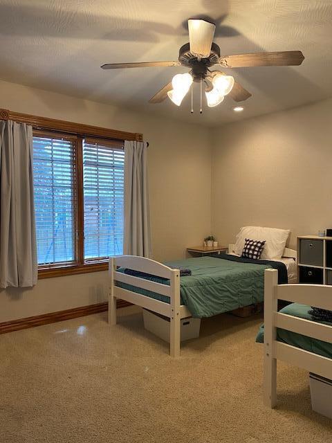 4822 S Montrose Pl, Springfield, MO 65810 - bedroom featuring baseboards, a ceiling fan, and carpet flooring
