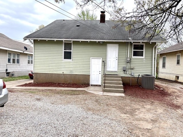 535 E Normal St, Springfield, MO 65807 - rear view of house featuring a chimney and a shingled roof