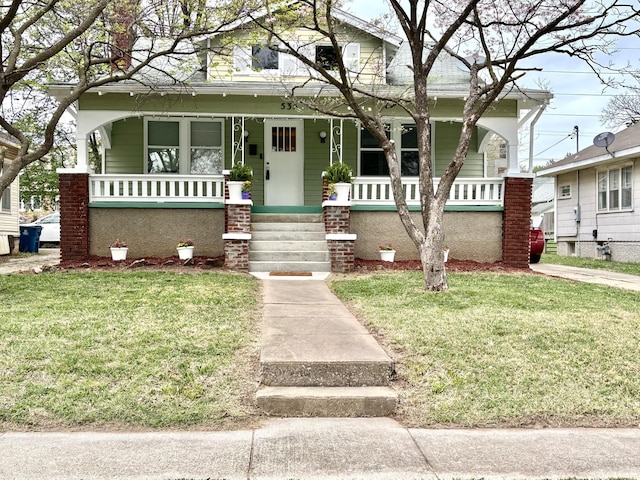 535 E Normal St, Springfield, MO 65807 - bungalow-style house with a porch and a front lawn