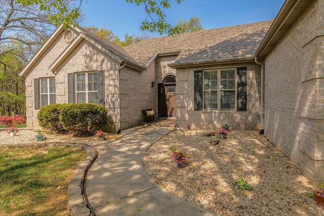 1302 Stoneycreek Ln, Branson West, MO 65737 - view of front facade featuring brick siding and a shingled roof