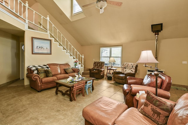 living room with high vaulted ceiling, a wealth of natural light, and a skylight