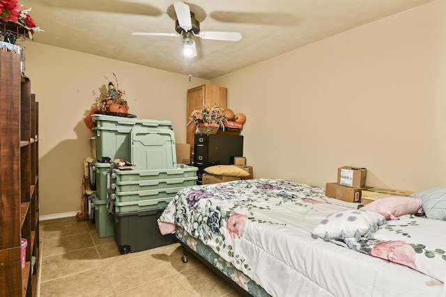 bedroom featuring light tile patterned flooring and a ceiling fan