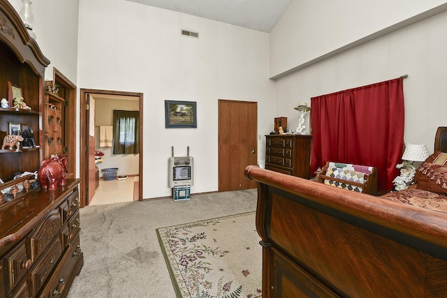 8100 Creek Rd, Hartville, MO 65667 - carpeted bedroom with ensuite bath, heating unit, a towering ceiling, and visible vents