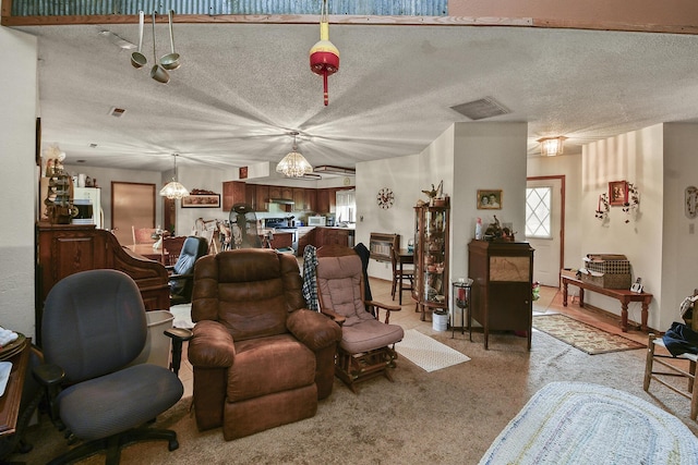 8100 Creek Rd, Hartville, MO 65667 - living room featuring a chandelier, a textured ceiling, visible vents, and light colored carpet