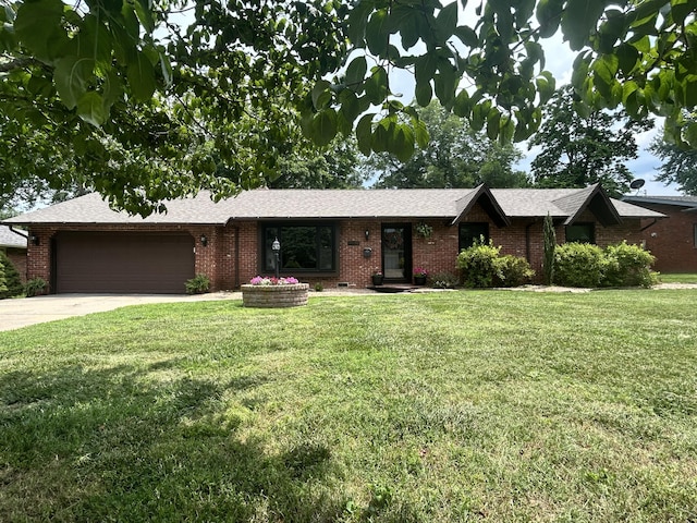 2036 E Greenwood St, Springfield, MO 65804 - single story home featuring a garage, a front lawn, concrete driveway, brick siding, and a shingled roof