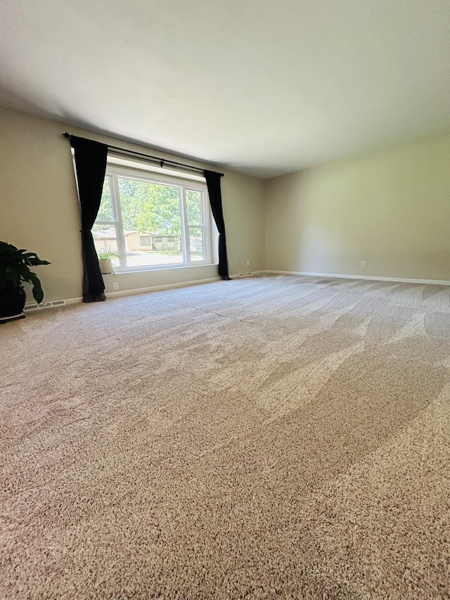 2036 E Greenwood St, Springfield, MO 65804 - carpeted empty room with baseboards