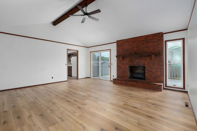 4542 S Holiday Ave, Springfield, MO 65810 - unfurnished living room featuring lofted ceiling with beams, light wood-type flooring, visible vents, a ceiling fan, and a fireplace